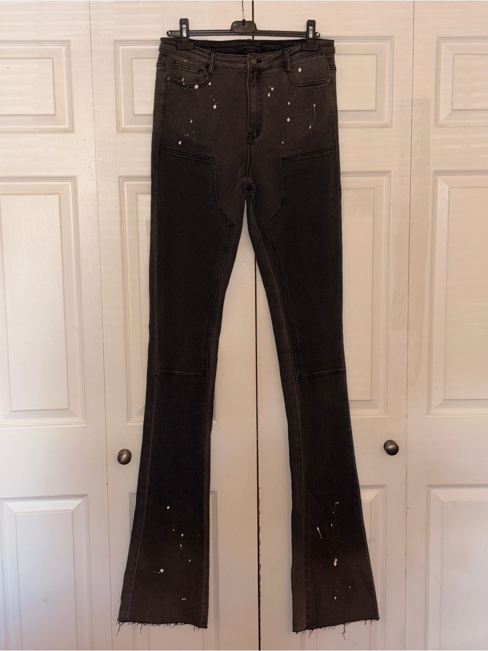 High-Rise Black Flare Jeans with Paint-Splash Detail